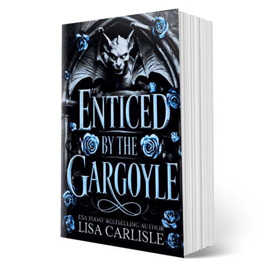 Book titled 'Enticed by the Gargoyle' with a gargoyle and roses on the cover, authored by Lisa Carlisle.