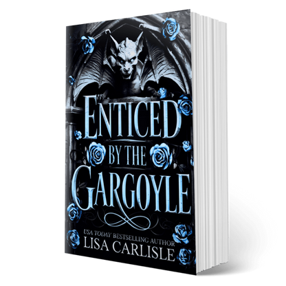 Book titled 'Enticed by the Gargoyle' with a gargoyle and roses on the cover, authored by Lisa Carlisle.