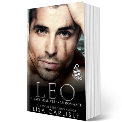 A paperback romance novel titled 'Leo', featuring a man on the cover with a serious expression, with a snow-covered background.
