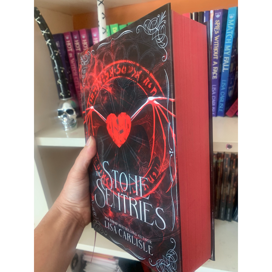 Book titled 'The Stone Sentinels' held by a hand with a bookshelf in the background