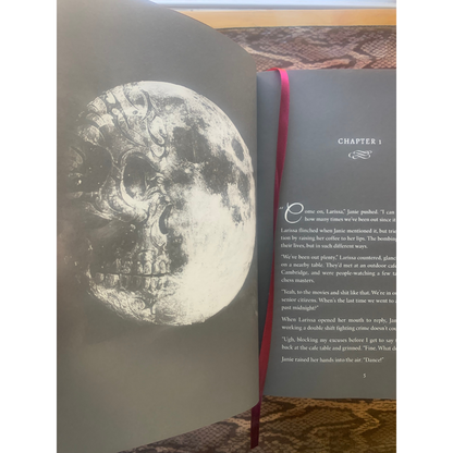 Book open to a page with a moon illustration on the left and text on the right.